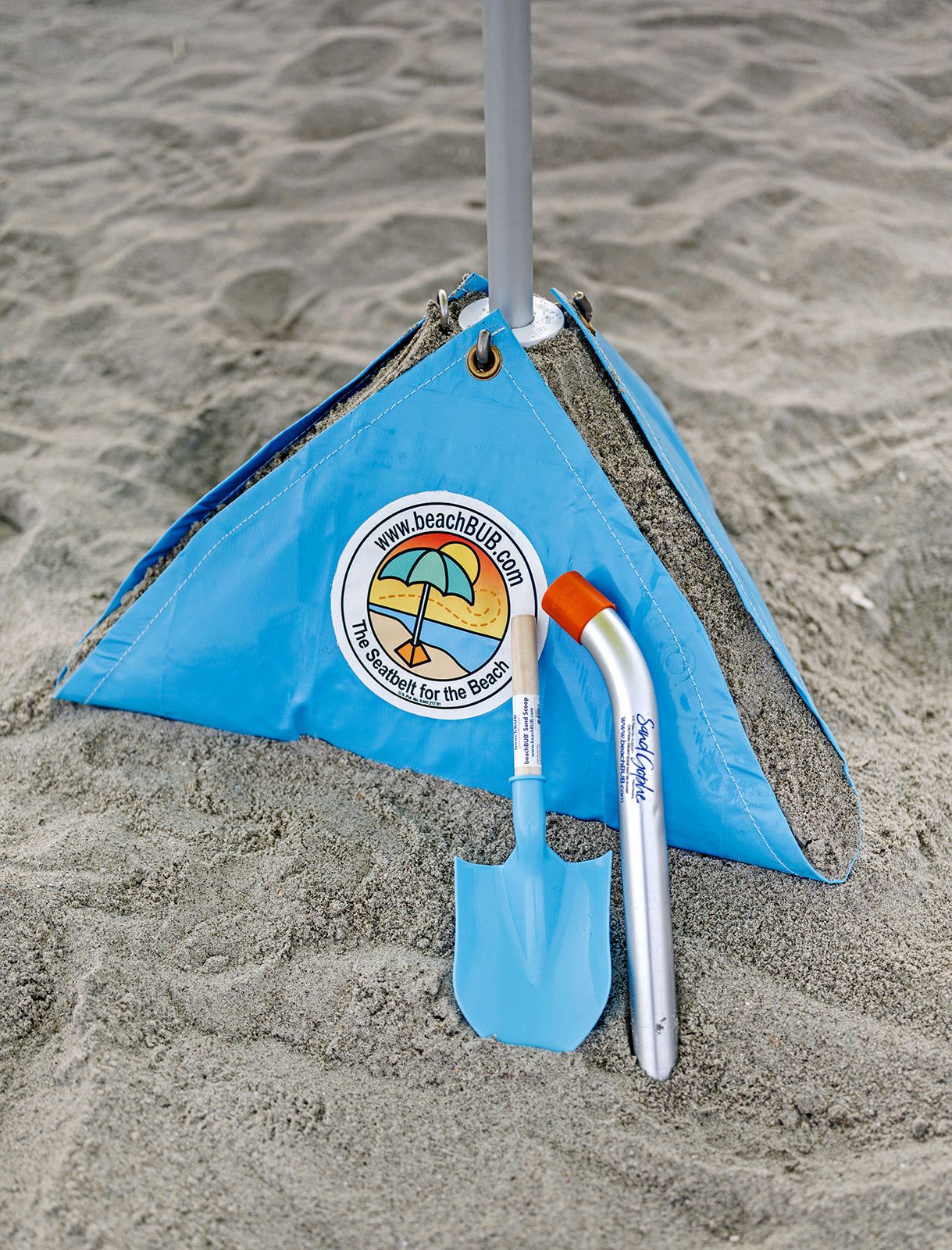 beach umbrella base with sand shovel and sand gopher