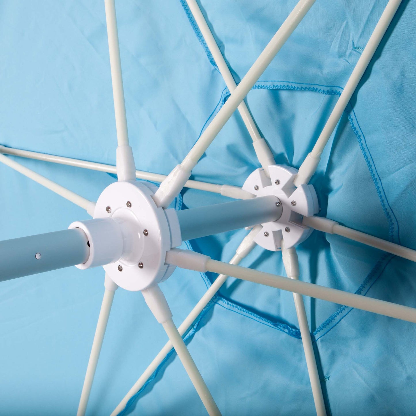 underside of caribbean blue beach umbrella canopy